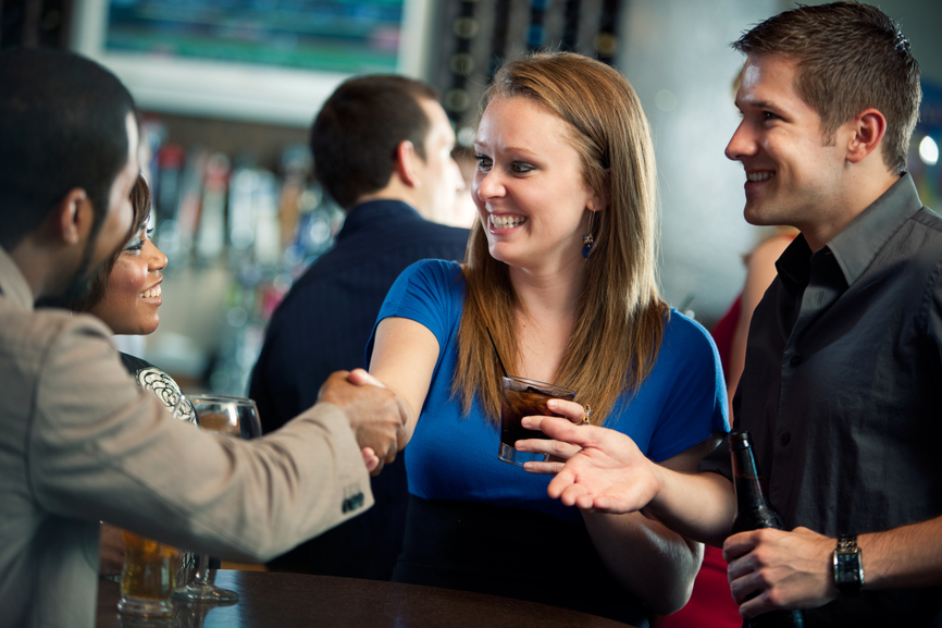 Extensive series of a multi-racial group of people having a good time in a bar/restaurant.