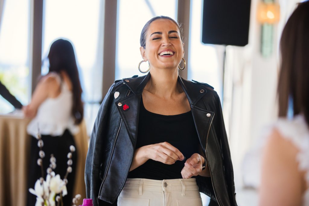 Woman laughing at the Hello Seven Mastermind retreat