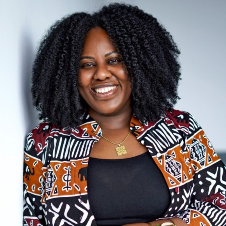 Smiling woman in a patterned jacket